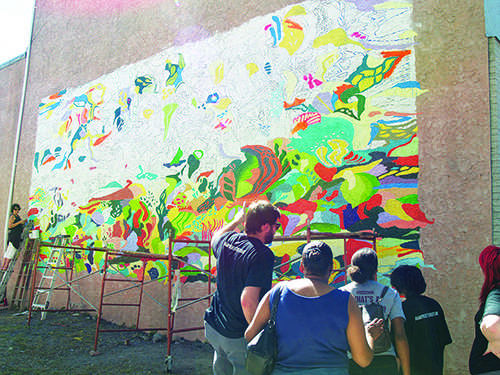 Volunteers work on murals through out the Stroudsburgs at the first-ever street art festival