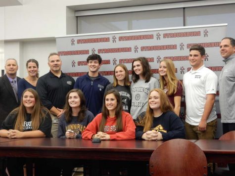 Nine students sign with colleges to continue their athletic careers — See photo gallery