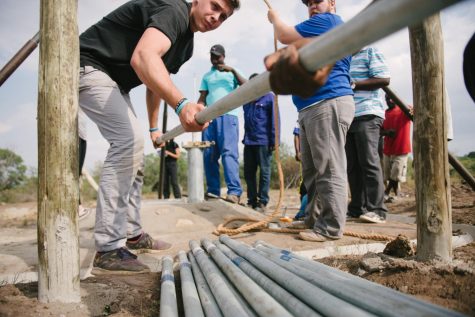 Evan Wesley, Thirst Project staffer, works to complete the building of a freshwater well in Kuntazi Swaziland.