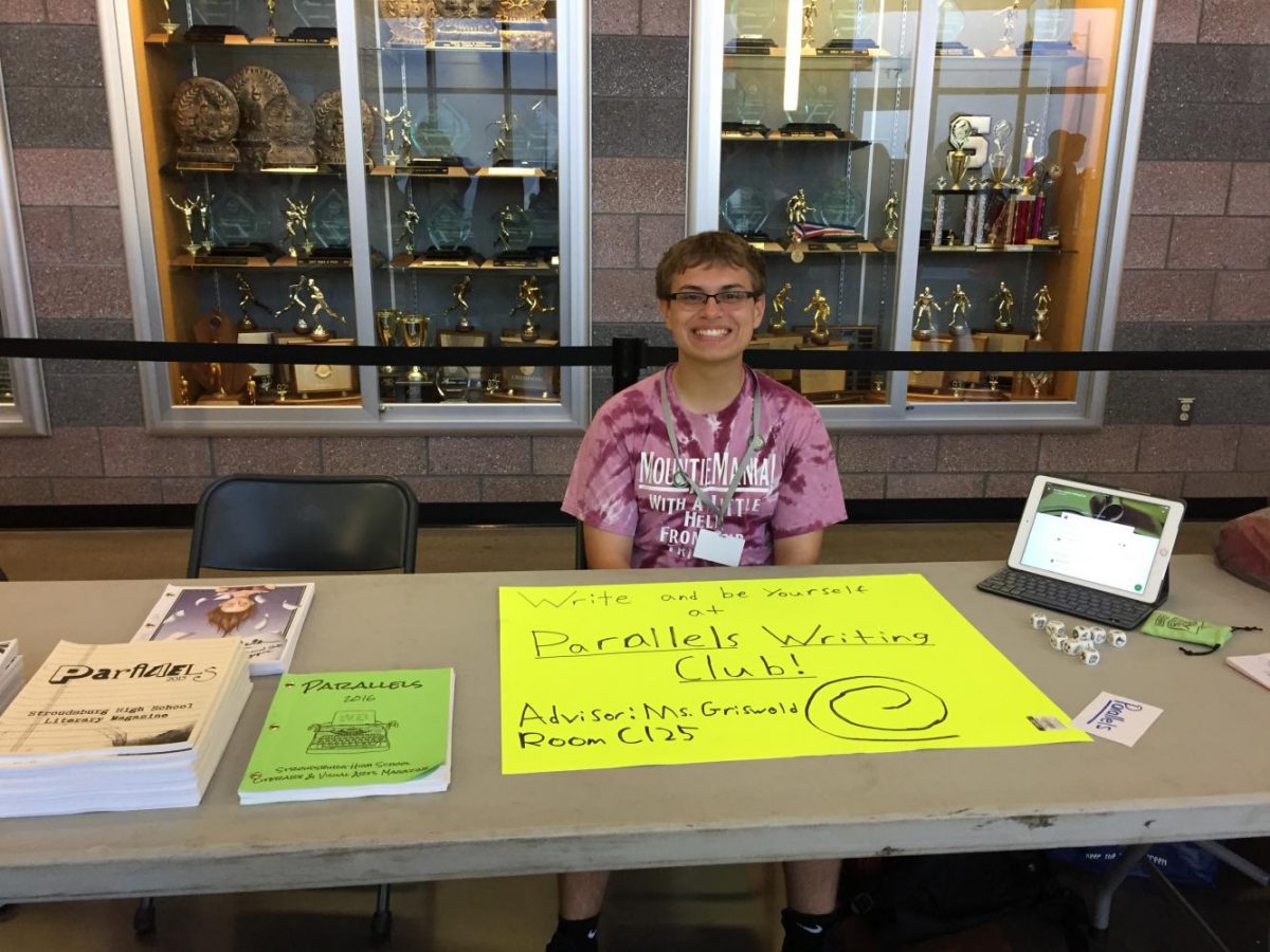 Junior Gabe Howard presented the Parallels Writing Club at the activities fair.