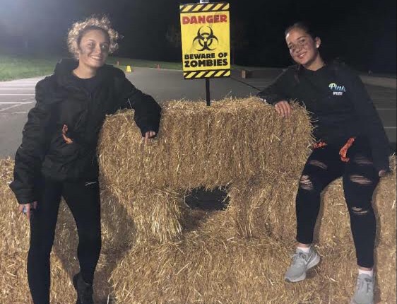 Key Club members volunteer for the Middle School Zombie Glow Run.