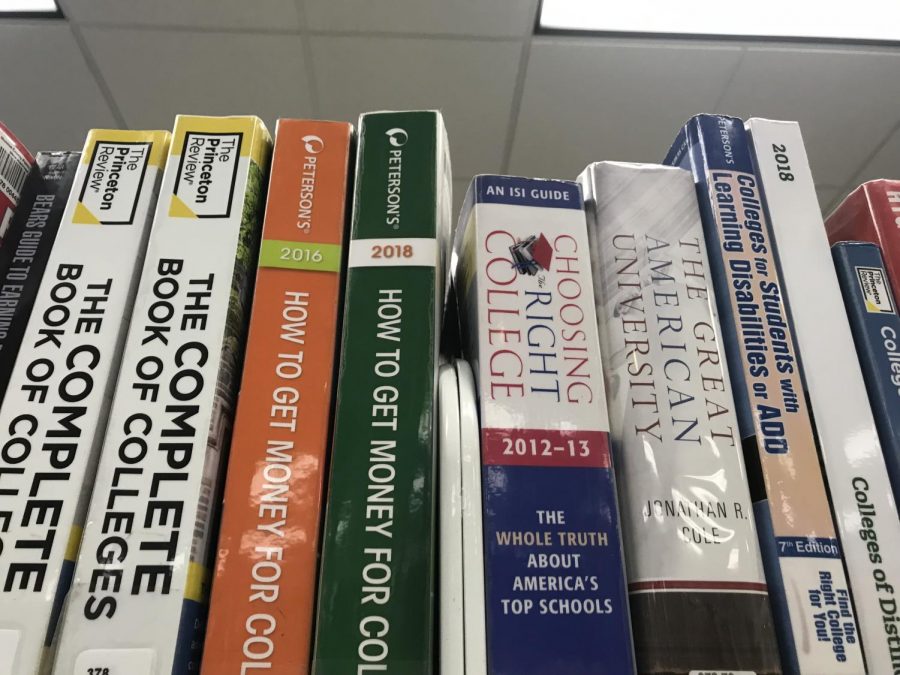 A pile of books about college admissions at the Eastern Monroe Public Library. 
