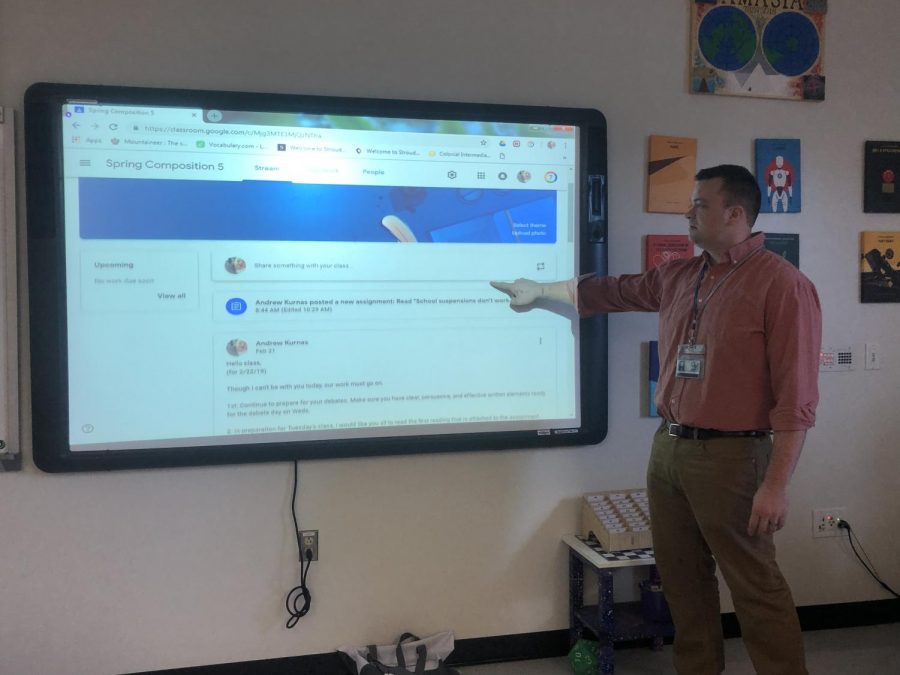 Mr. Andrew Kurnas going over a Google Classroom assignment. 