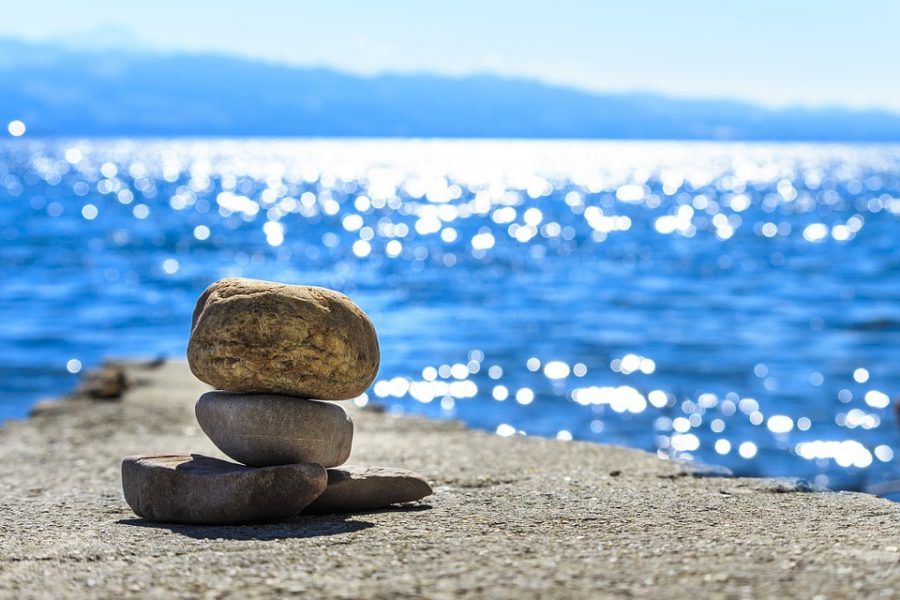 A view of the ocean with rocks finding a balance.