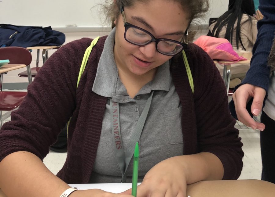 Senior Amaya Cruz is writing in her journal to release excess anxiety.