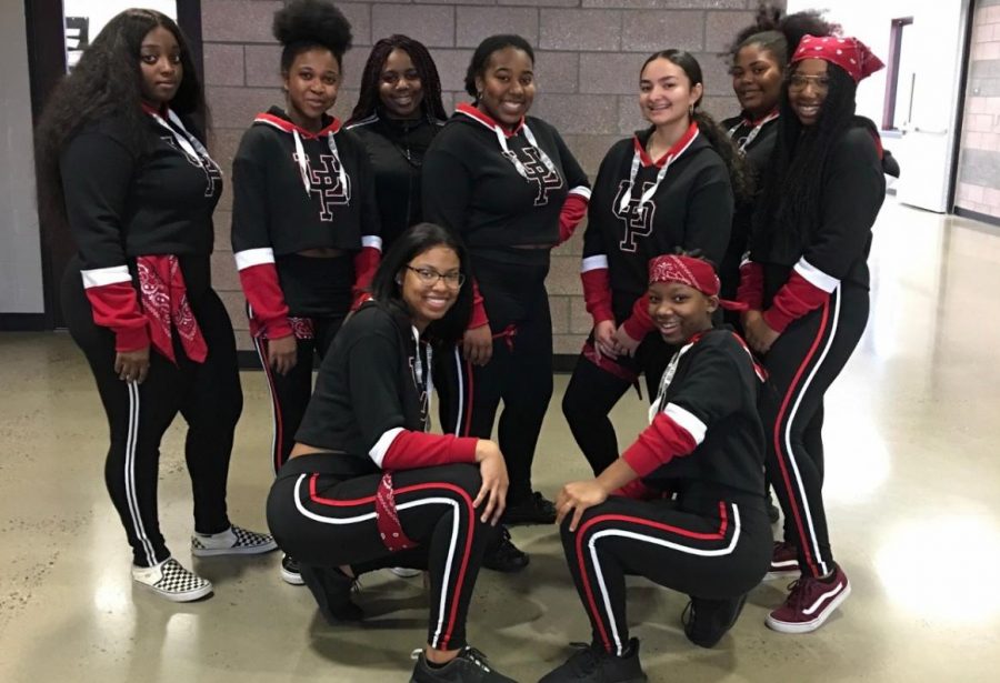 The step team poses for their annual school performance. 