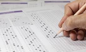 A student filling out an answer sheet.