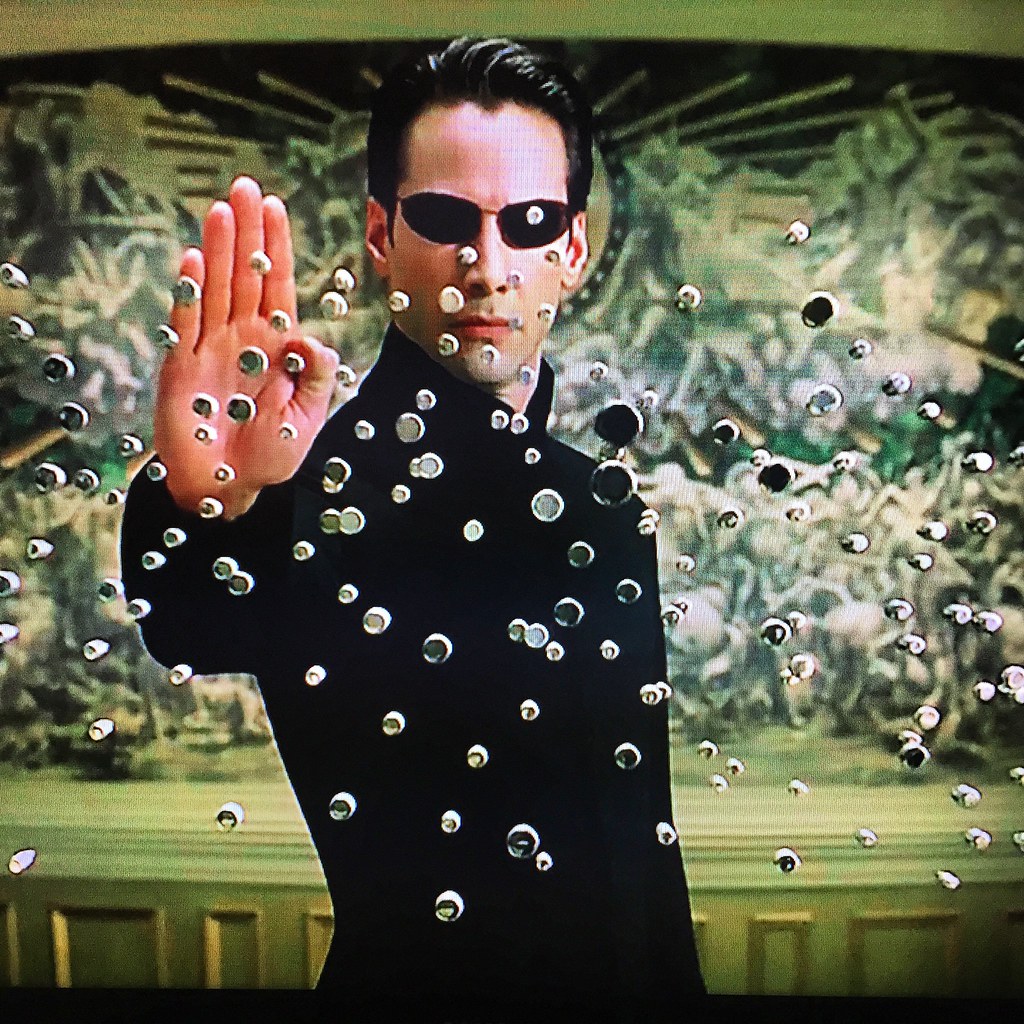 Neo From Matrix Stopping Bullets