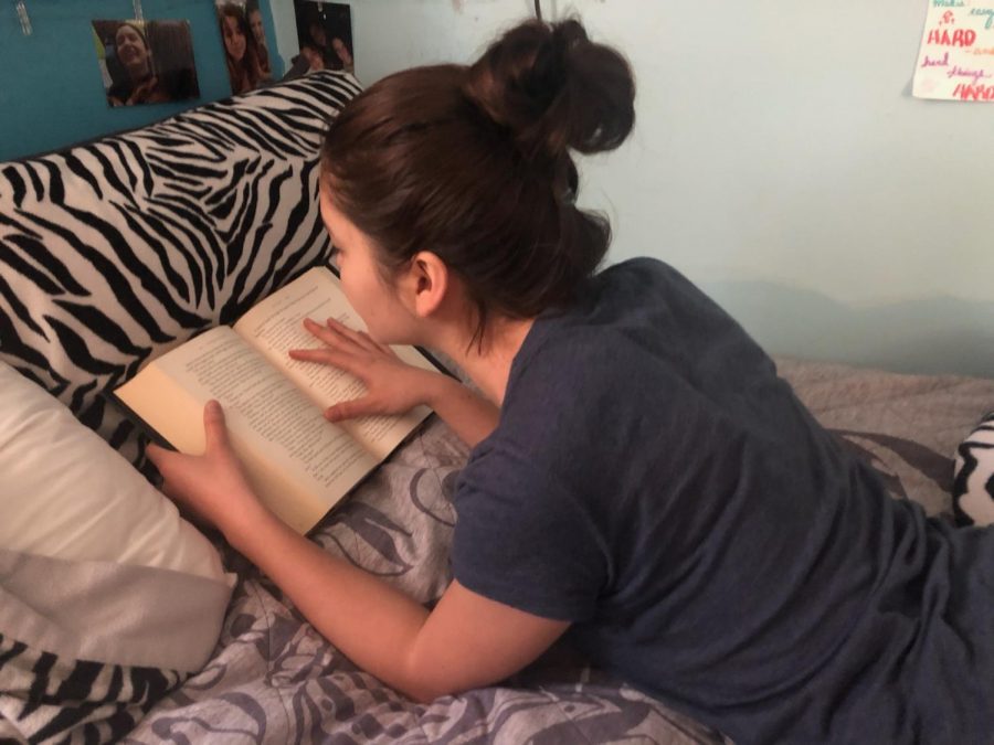 Freshman Mari Wendt conducts her morning routine, starting with reading her favorite book for twenty minutes.