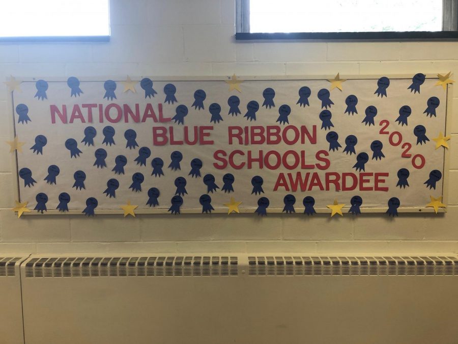 A bulletin board dedicated to Moreys National Blue Ribbon award lights up the schools hallways. 