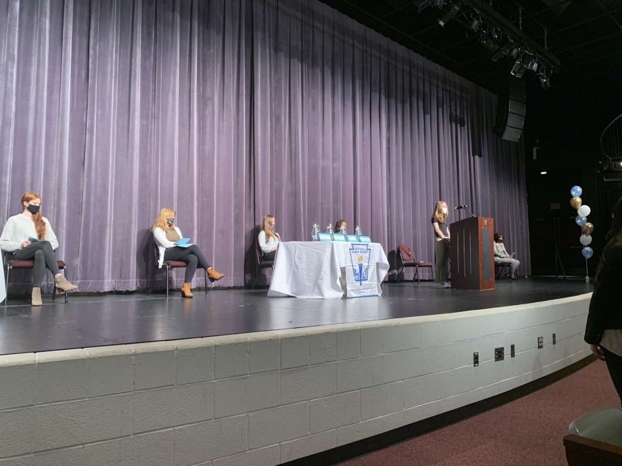 President Gemy Hodzova congratulates the newest members of NHS.