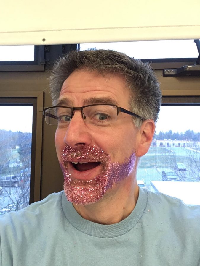 Mr. Balas pictured with a sparkly purple beard.