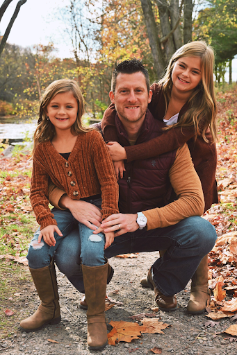 Photo of Mr. Black and his 2 daughters. 