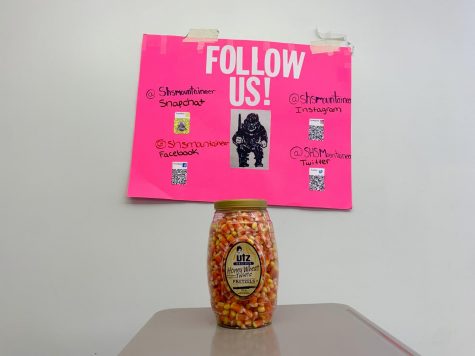 The jar of candy corn is pictured, along with the Mountaineers social media information.