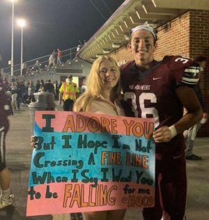 Juniors Gio Silva and Ciara Longo smile for a photo together after Gios Homecoming proposal.