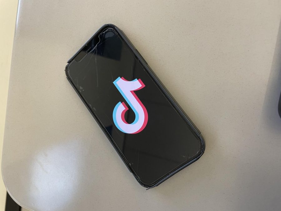 The Tik Tok social media application loading screen is pictured as a student opens up to view the newest videos.  