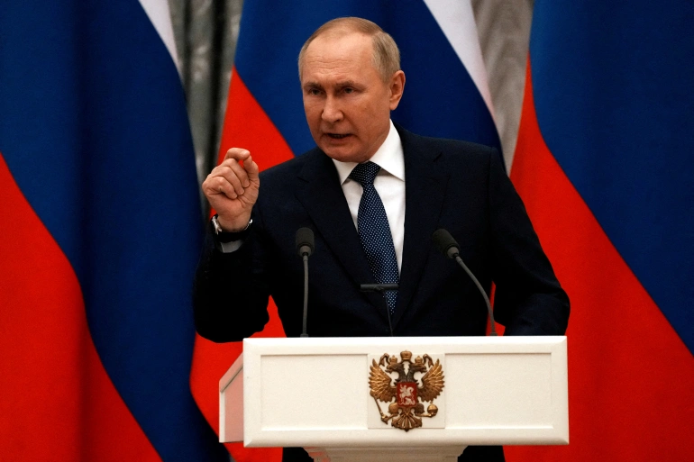 Russian President Vladamir Putin gestures to a crowd during a press conference in Moscow.