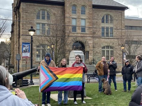SHS students and a community member pose for a photo at the We Say Gay rally in front of the Monroe County Courthouse.