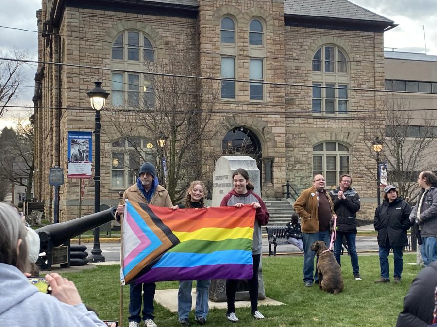 SHS+students+and+a+community+member+pose+for+a+photo+at+the+We+Say+Gay+rally+in+front+of+the+Monroe+County+Courthouse.