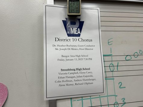 The paper hung in the choir room listing the district choir qualifiers. 