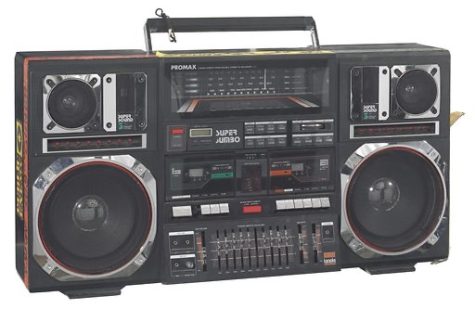A Promax Super Jumbo boombox (2014.270.2.1a) used as a prop by the character Radio Raheem in the Spike Lee directed picture, Do the Right Thing. The boombox includes a dual audio casette tape deck, an equilizer section, radio dial, coloured light display, and a pair each of 8 subwoofers, midranges, and tweeters. There are sections of red, yellow, and green electical tape with black ink text on the sides and top of the player. There are also rectangular black, green, and yellow Public Enemy stickers adhered to both the PR and PL side of the player. On the lower back of the boombox is handwritten text in gold ink reading [BROOKLYN, NY / 3/17/90 / To Gene / RADIO RAHEEM LIVES / LOVE, Spike Lee / FIGHT THE POWER]. There is a metal handle attached to the top of the player, around which two braided bracelets (black-and-white 2014.270.2.1b, coloured 2014.270.2.1c) and multi-coloured printed cloth (2014.270.2.1d) have been tied. The rewind button on the PR tape deck has fallen off but is stored with the boombox (2014.270.2.1e). The boombox had an audio cassette in the PR deck that has been removed (2014.270.2.2), titled JAZZ CLUB / Vocal. The cassette is off-white with black text and is printed with track titles, manufacturing information, and serial number. Date: 1980s. Record ID: nmaahc_2014.270.2.