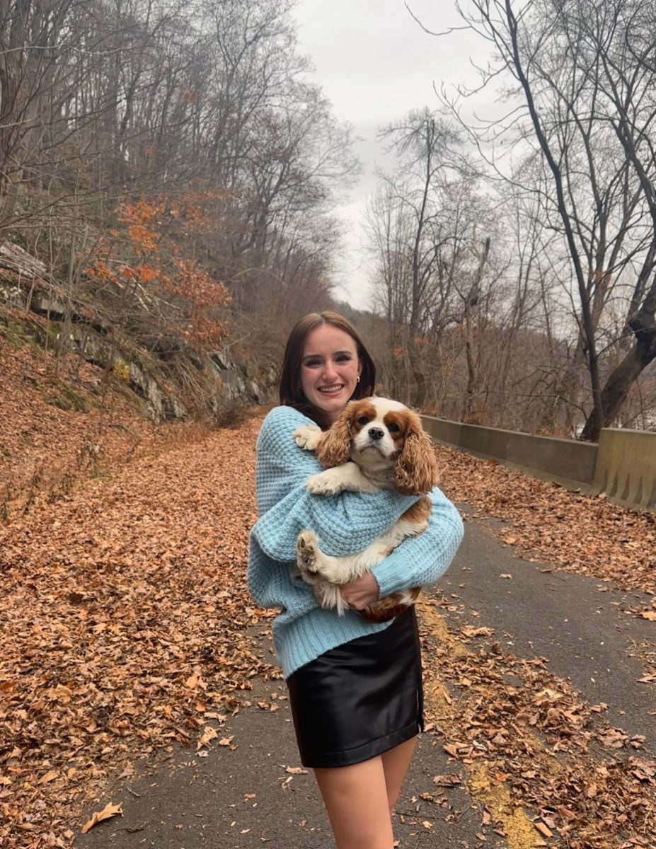 Photo of Stroudsburg High school student Catharine Brinker with her dog.