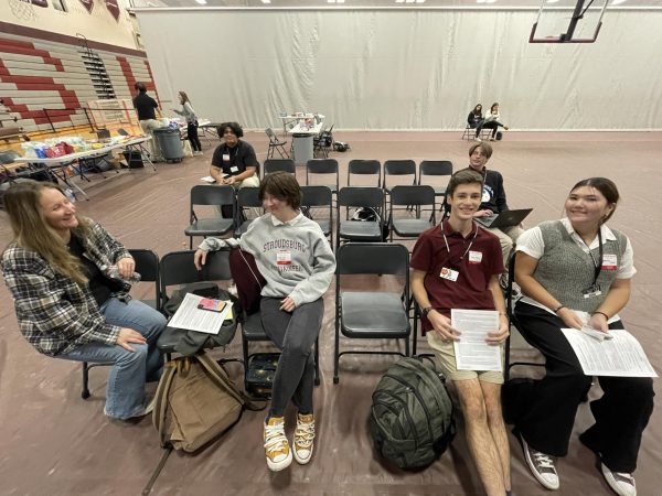 Students sit, waiting there turn to donate blood to those in need.