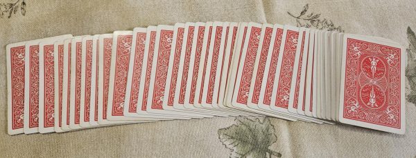 A deck of playing cards set up for a magic trick.