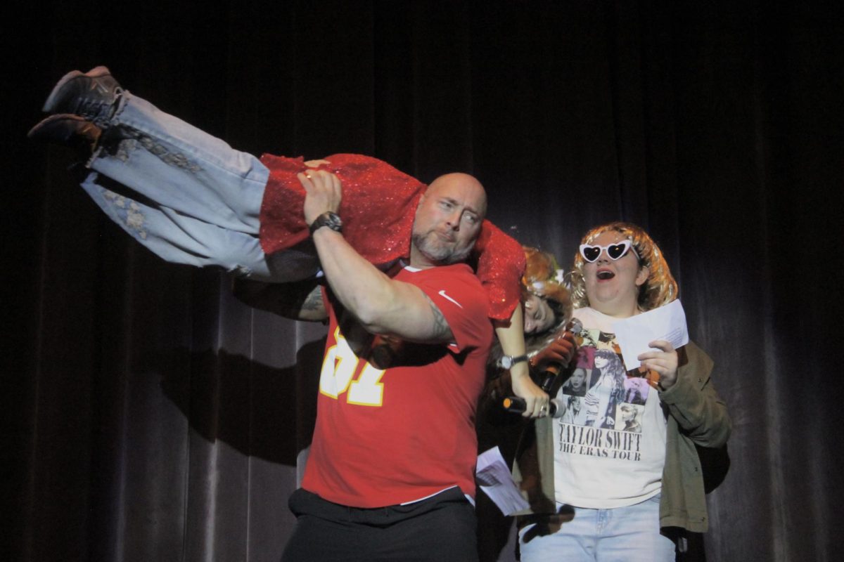 Mr. Perry played Travis Kelce, sweeping Swift (Austin) off her feet. 