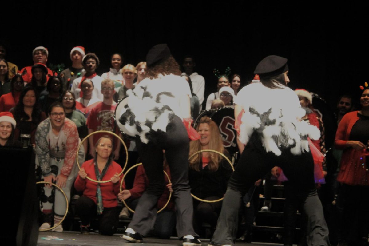 French Hens are shaking their feathers in the 12 Days of Christmas skit. . 