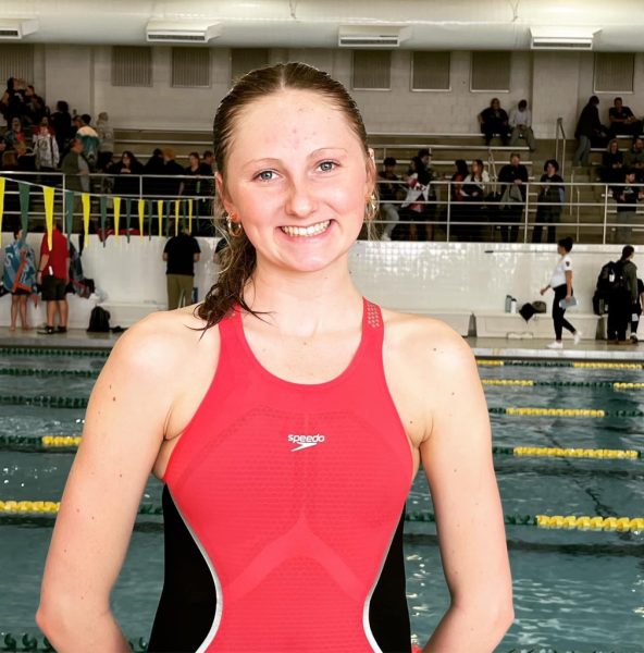 Anna Kirby poses for a picture after beating her second record of the season.