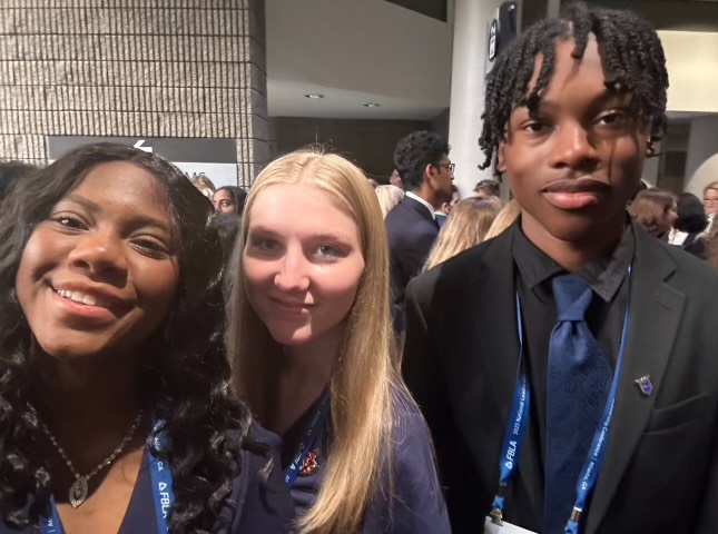 Madison Cottle, 12 (left), Jessica Haggerty, 11 (middle), and Isaiah Louis-Jacques, 12 (right) all pose for a picture together.