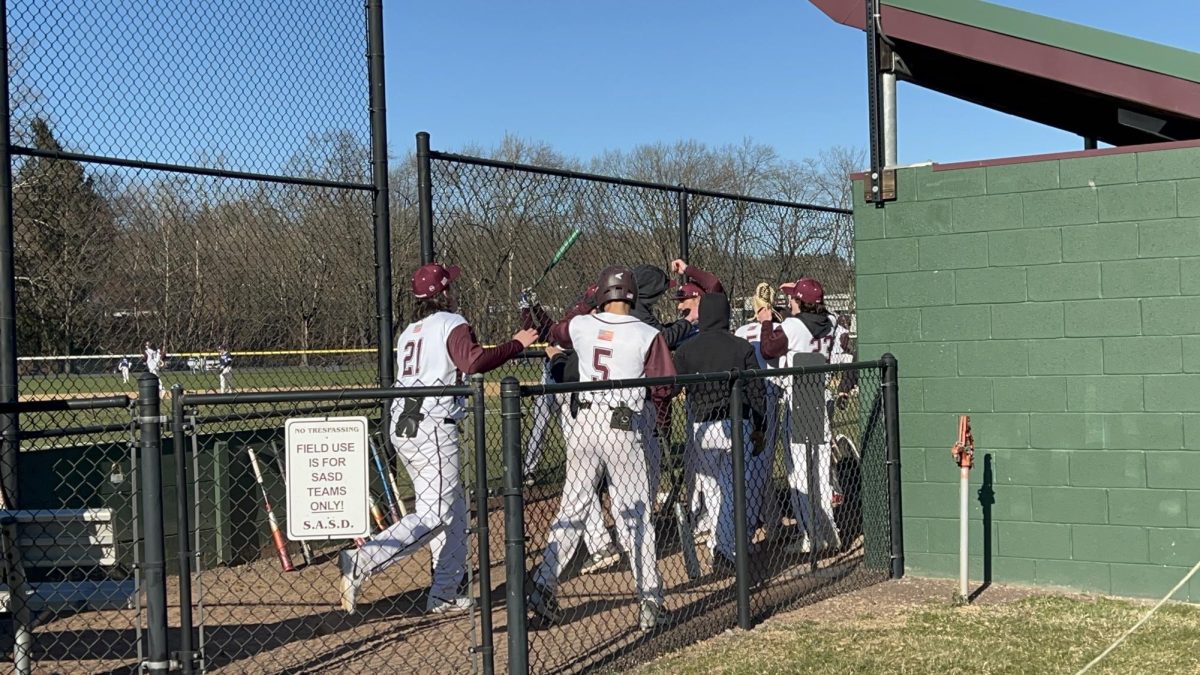 Team celebrating in dugout after Ryan Pacitti scores to make Stroudsburg lead 4-1 in the 4th inning.