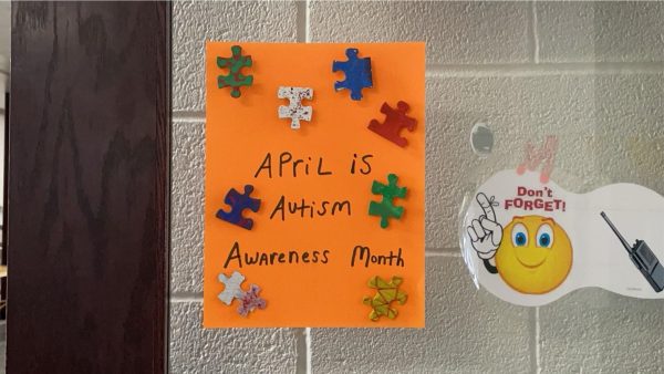 Sign hung up on classroom door sharing the news of Autism Awareness Month to SHS students.