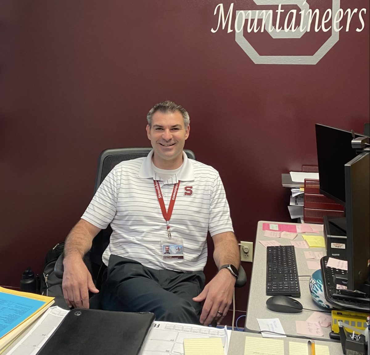 Mr.Williams the new vice principal at the Jr.high posing at his desk. 