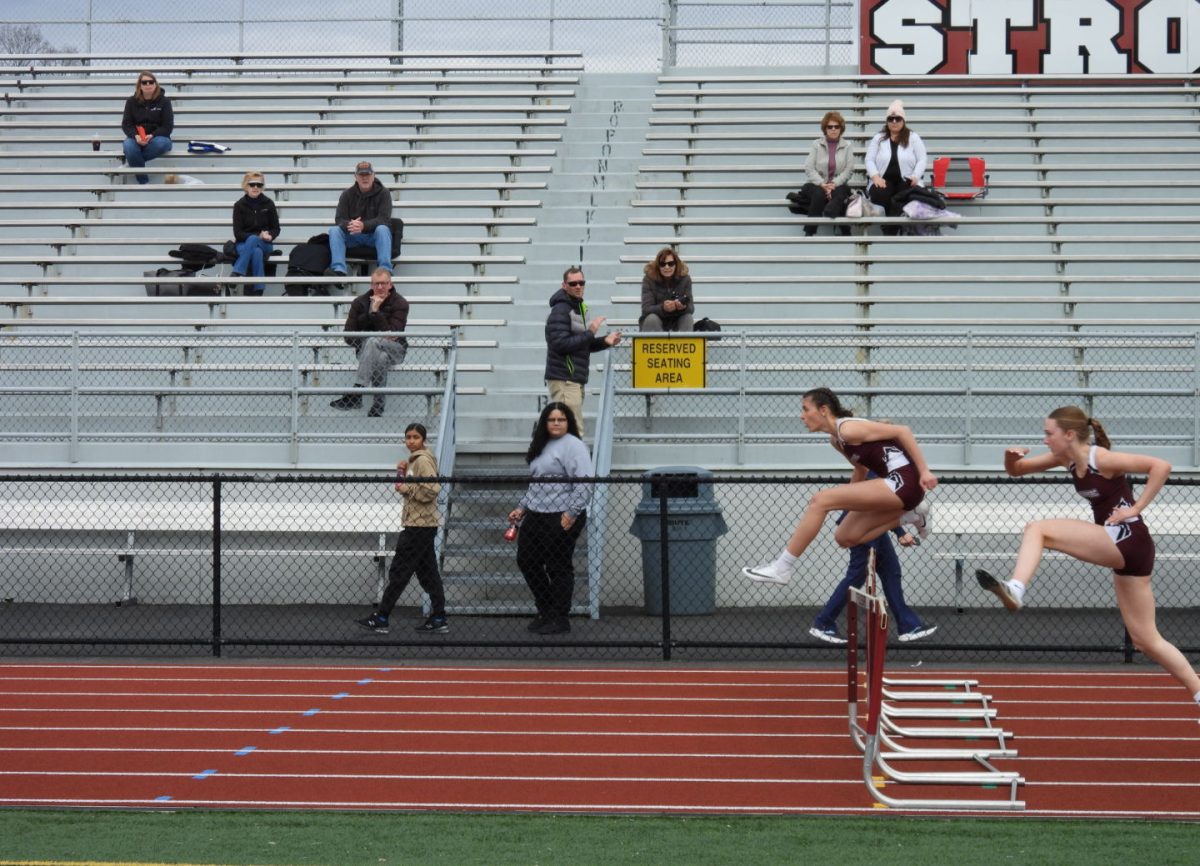 Olivia Full, 10, and Grace Coyne, 10 run hurdles at their first home meet against Northampton High School on March 26 winning 104-46.
Photo credit, Amir Lovell, 10. 