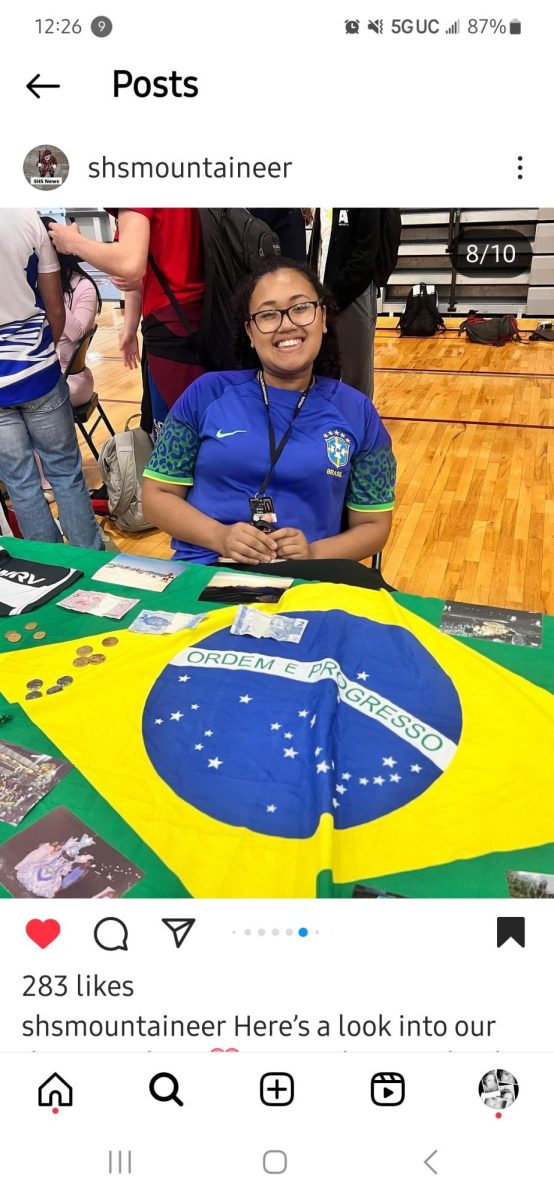 Kathleen Carpio,10, hosted a table for Brazil. Photo courtesy of SHSMountaineer Instagram. 

