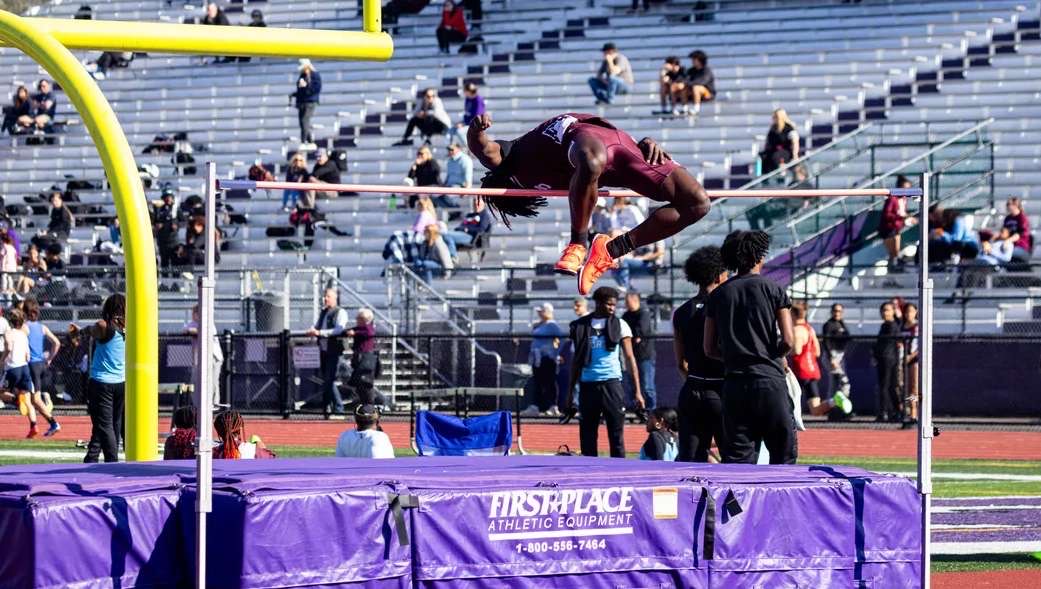 Kamoni Smith-Johnson, 12, competing in high jump.