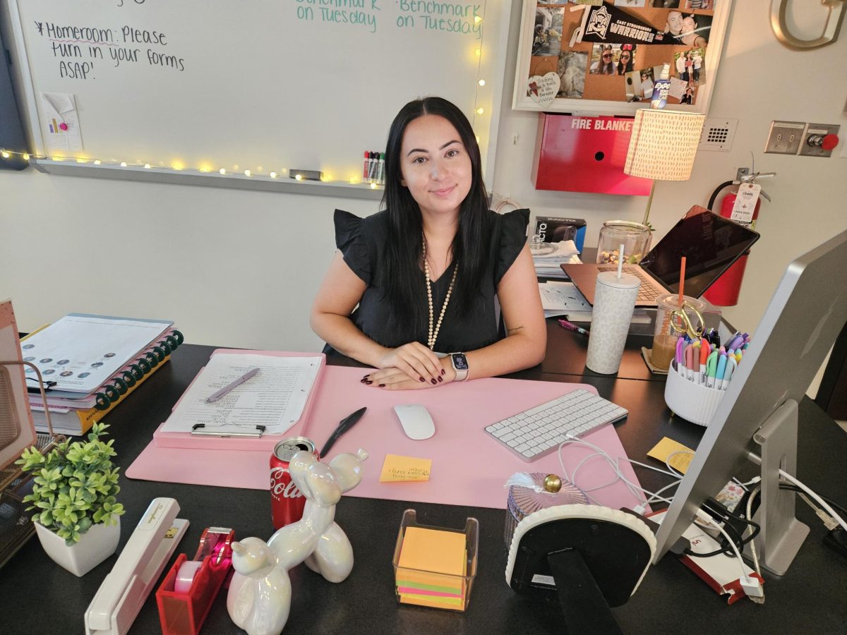 Ms.Giordano our new biology teacher sitting at her desk