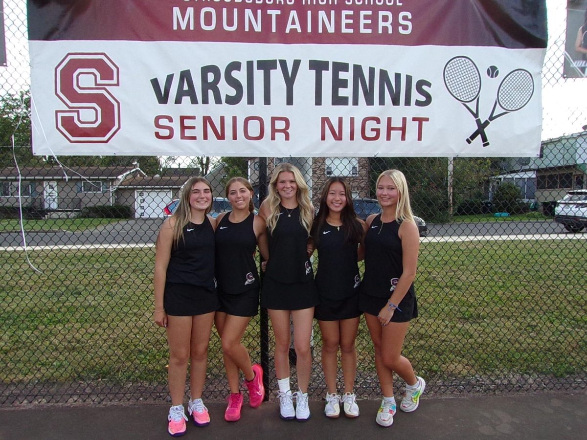 Seniors Shelbi Calligari, Lana Marsh, Madison Noonan, Julianna Vo, and Berlin Ulmer posing for a picture during their senior night.