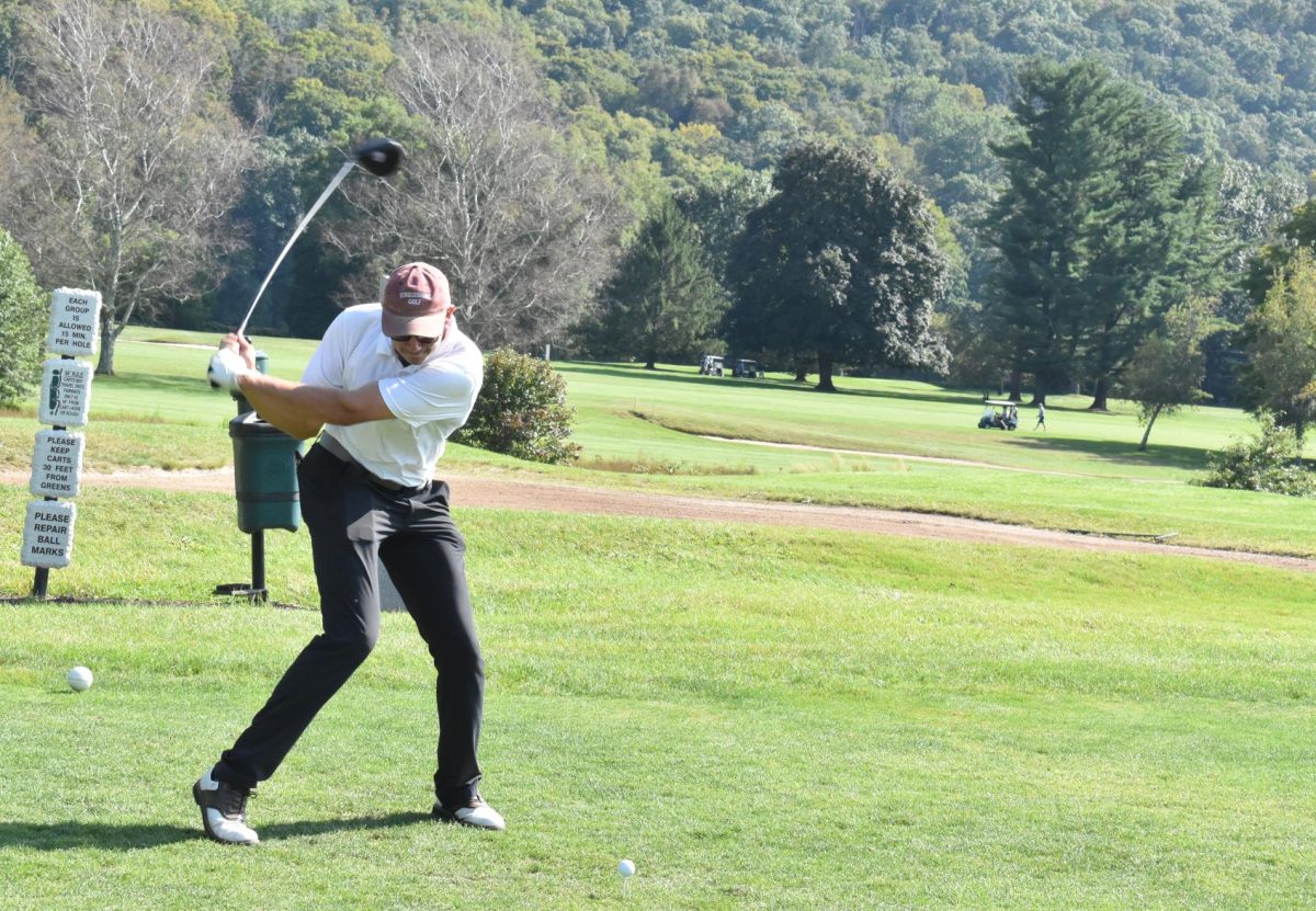 Hunter Probst, '25, leading the team with his drive down the course.