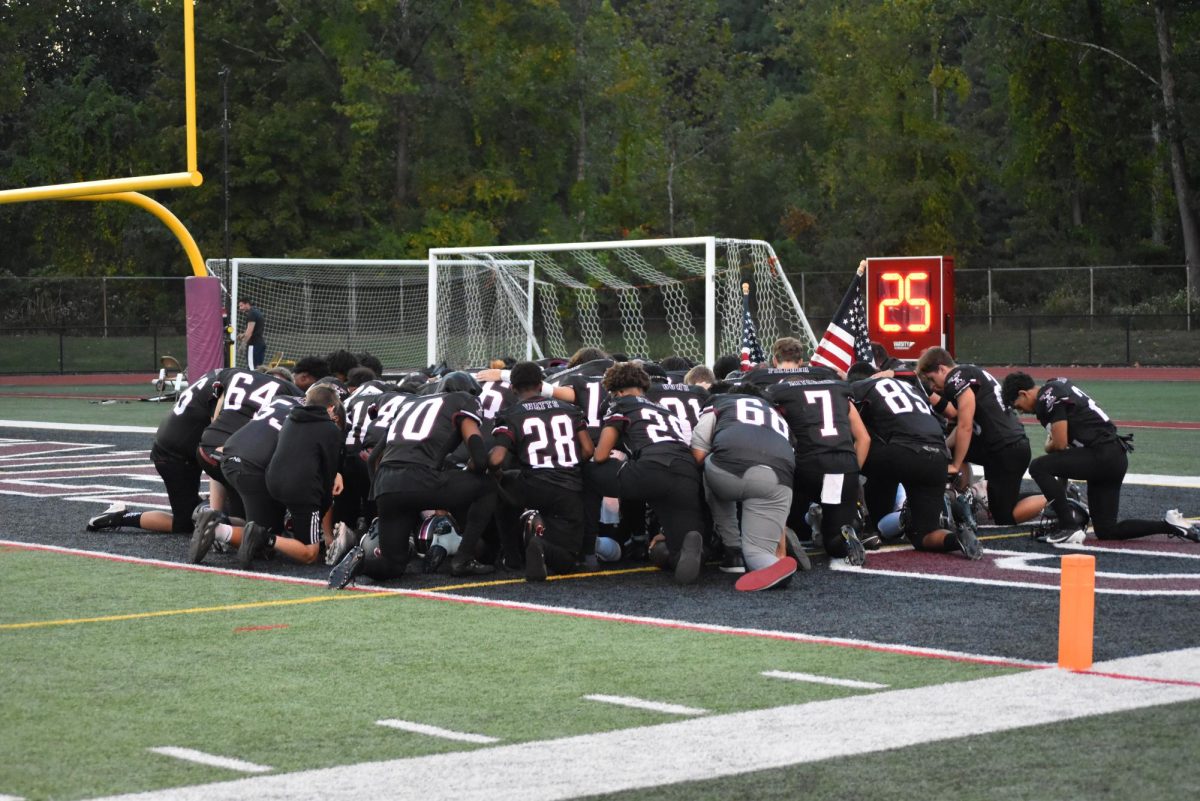 Stroudsburg Football team huddles together before their game against Pocono Mountain East.