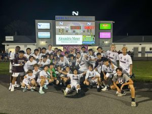 Stroudsburg poses under scoreboard as they defeat Nazareth, 1-0 on August 29, 2024.