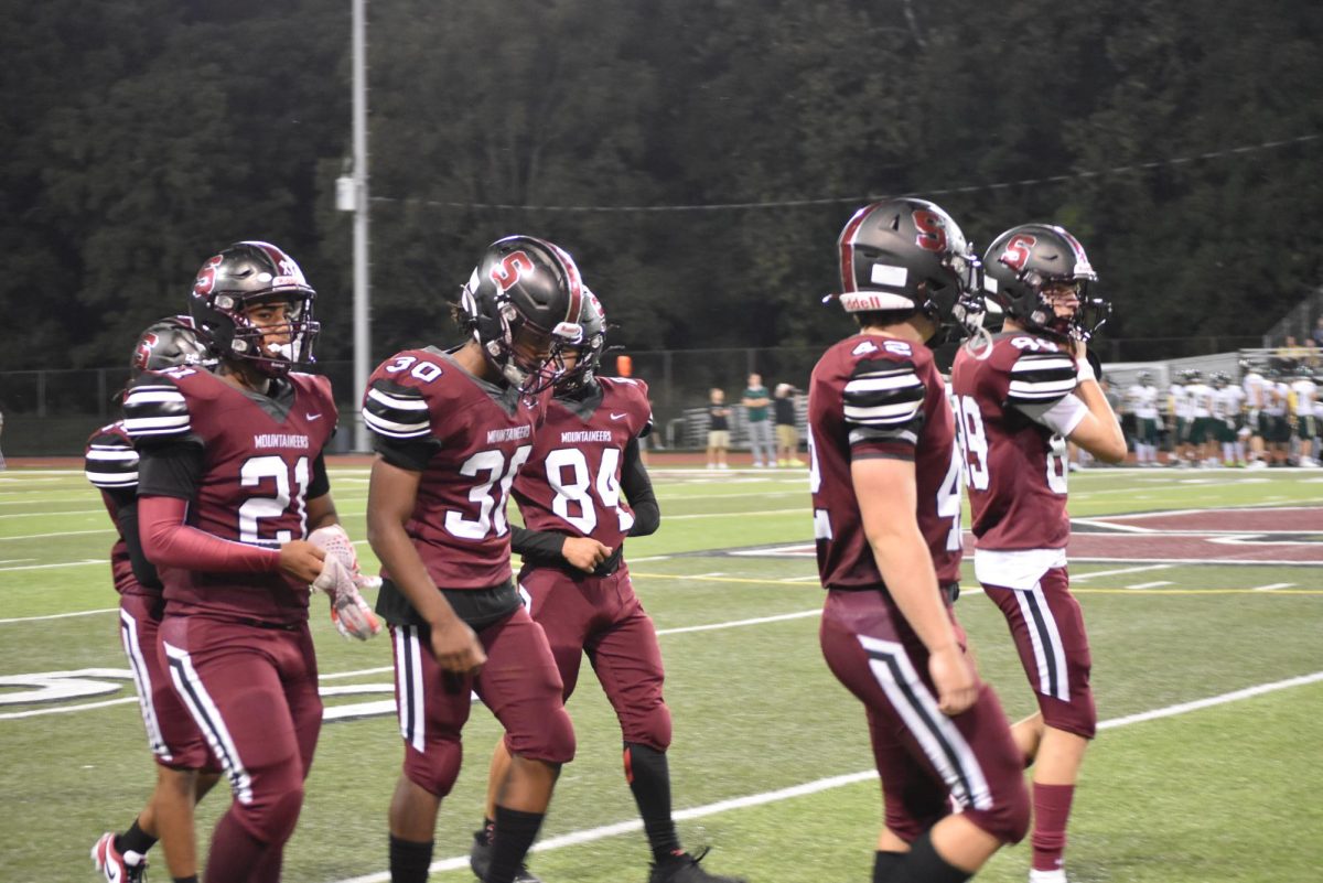 Kevin Rodriguez, '27, Karis Wilkins, '26, Octavian Riszko, '26, Gabe Ferguson, '27, and Keyen Johnson, '27, regroup after rough play against Emmaus.