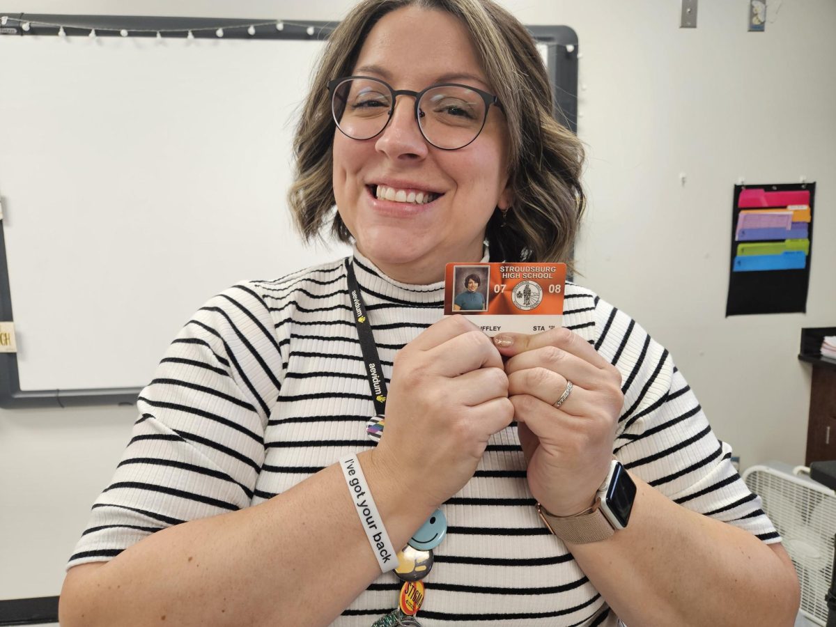 Mrs.Tkach posing with her first Stroudsburg badge from 2007.