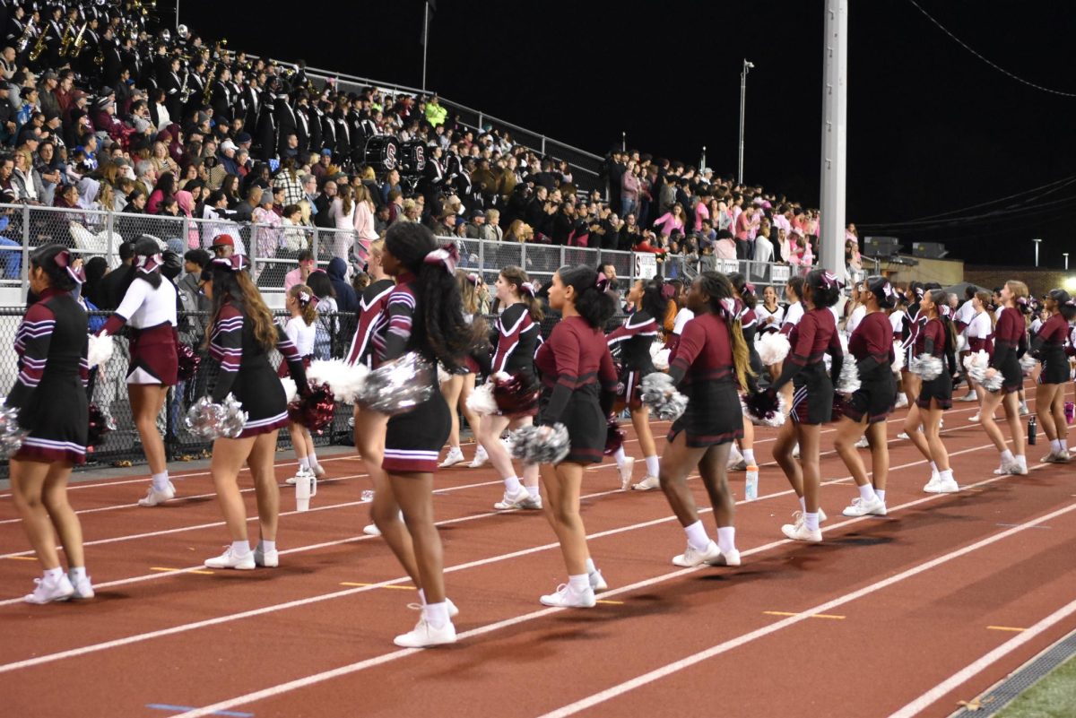 Stroudsburg Middle, Junior High, and High school students cheer at homecoming game. 