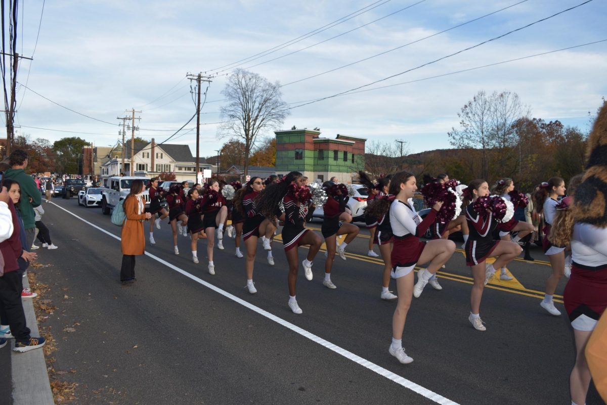 Stroudsburg Cheerleading walks in the Homecoming Parade to bring the pep to the upcoming game against Pleasant Valley. 