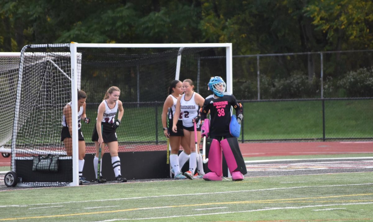 The girls of Stroudsburg Varsity Field Hockey huddle up to discuss a game plan.