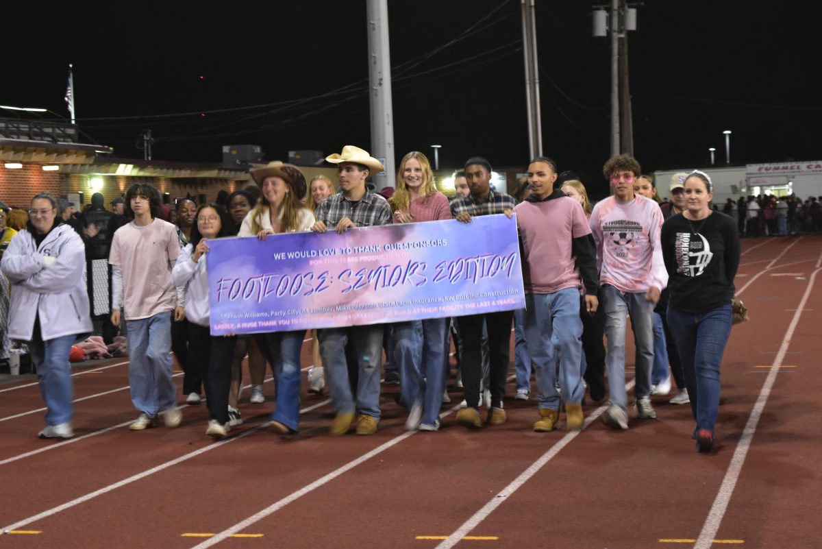 Class of '25 walk onto the sidelines as each class prepares to hear the results from the float judges. 