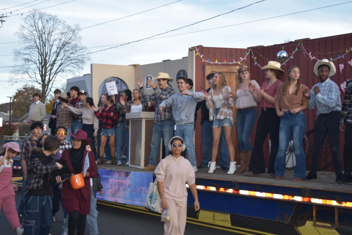 Class of '25 rides their float down Main Street during the Homecoming Parade.